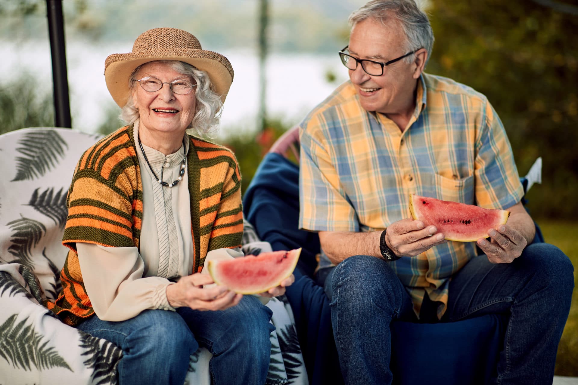 Senior couple on romantic vacation eating watermelon